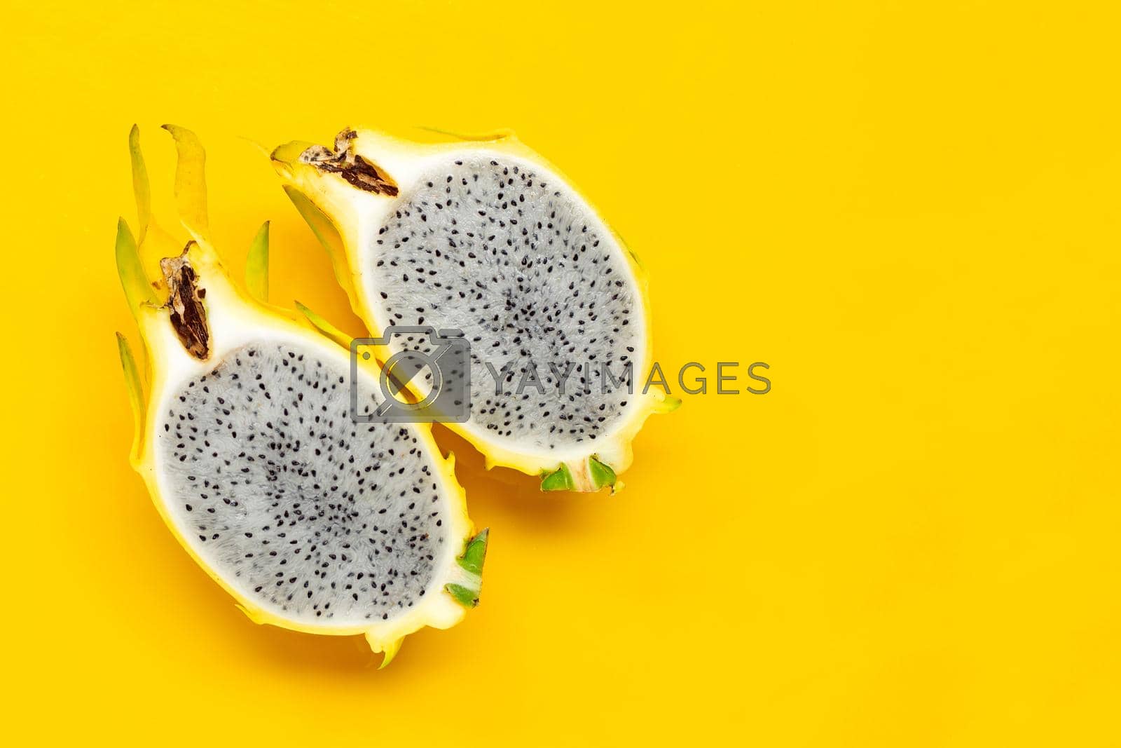 Royalty free image of Yellow pitahaya or dragon fruit on yellow background. by Bowonpat