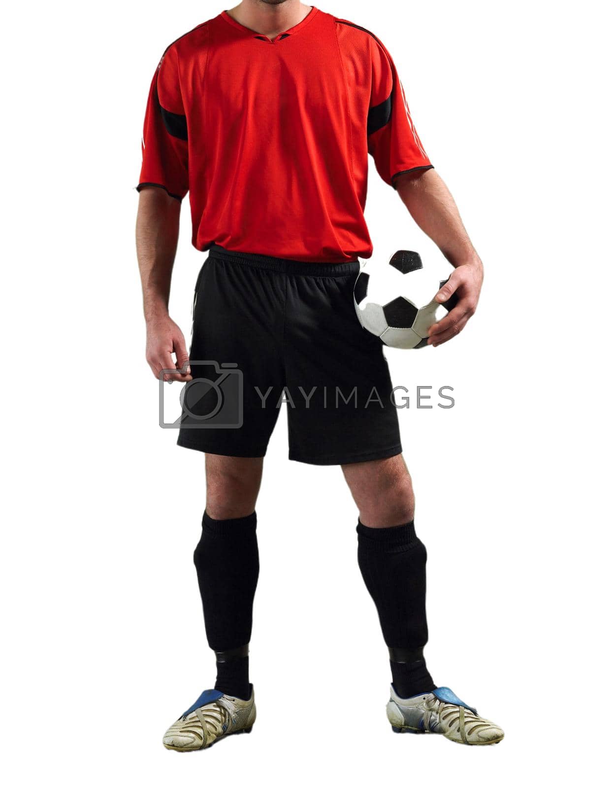 Royalty free image of Cropped Soccer Player holding football in studio by moodboard