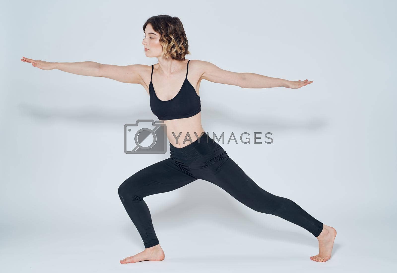 Exercises slim woman yoga asana light background meditation model. High quality photo