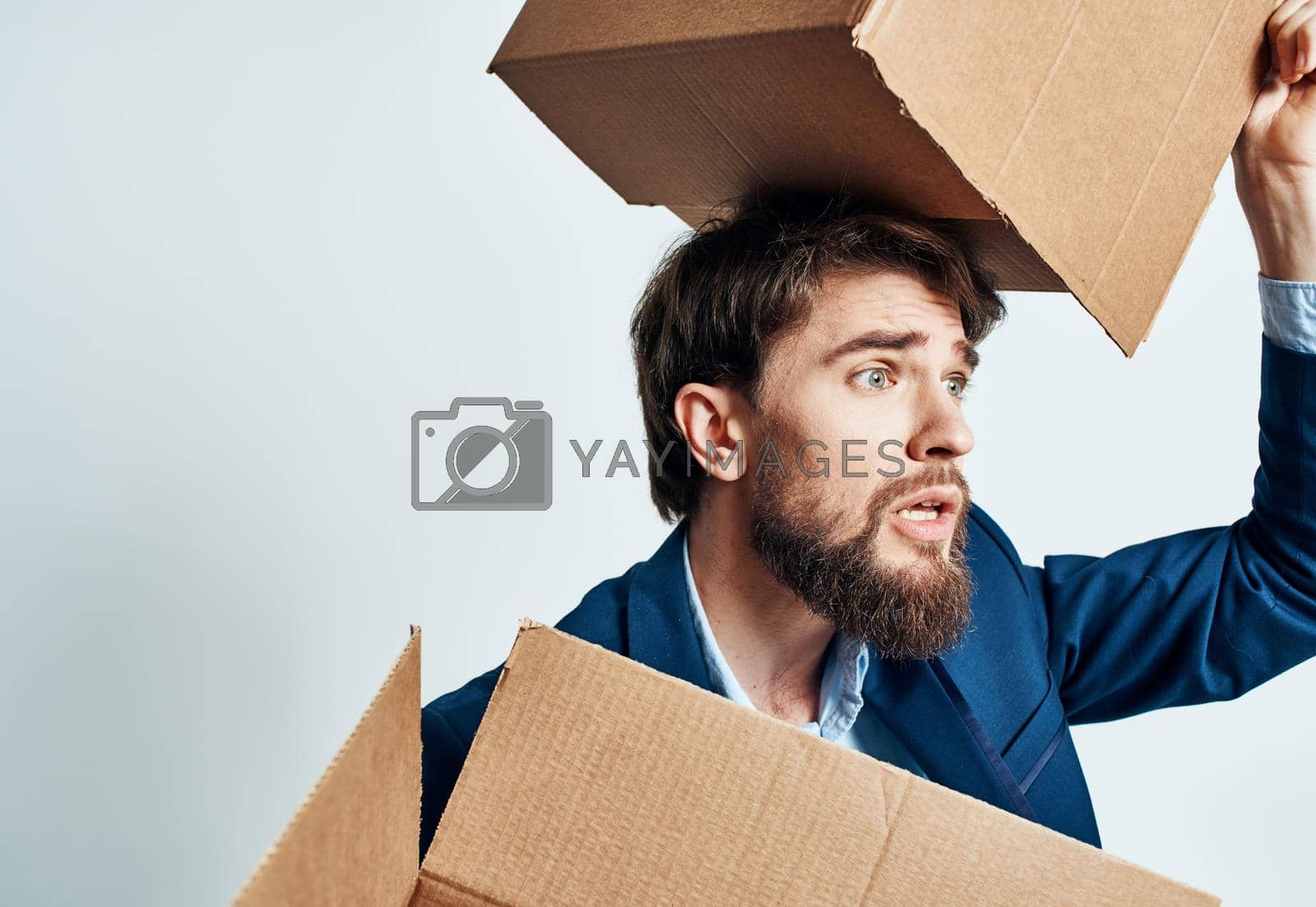 Royalty free image of man with boxes in groups moving new place of work lifestyle official by SHOTPRIME