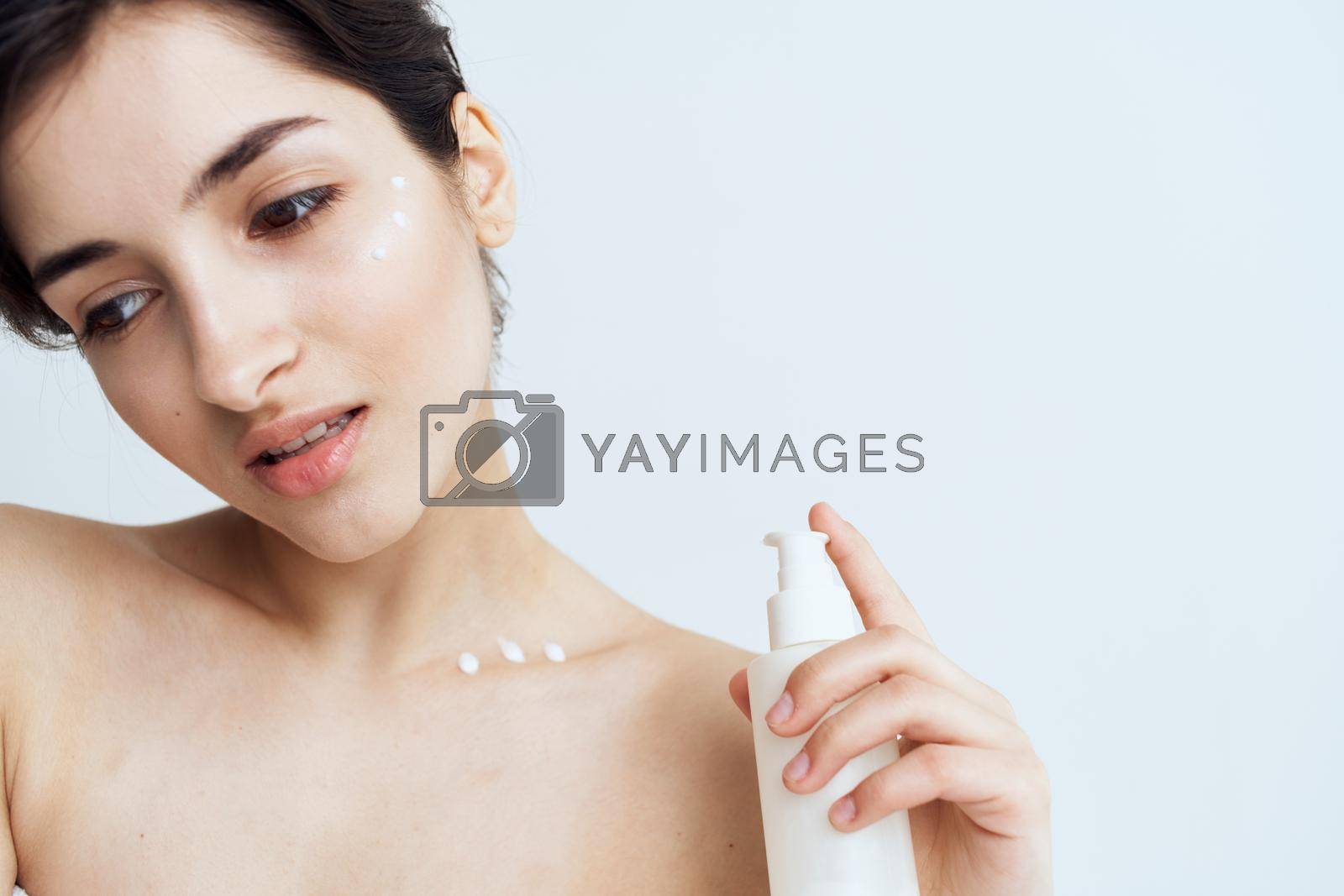 Royalty free image of Pretty woman wears skin care cosmetics dermatology by SHOTPRIME