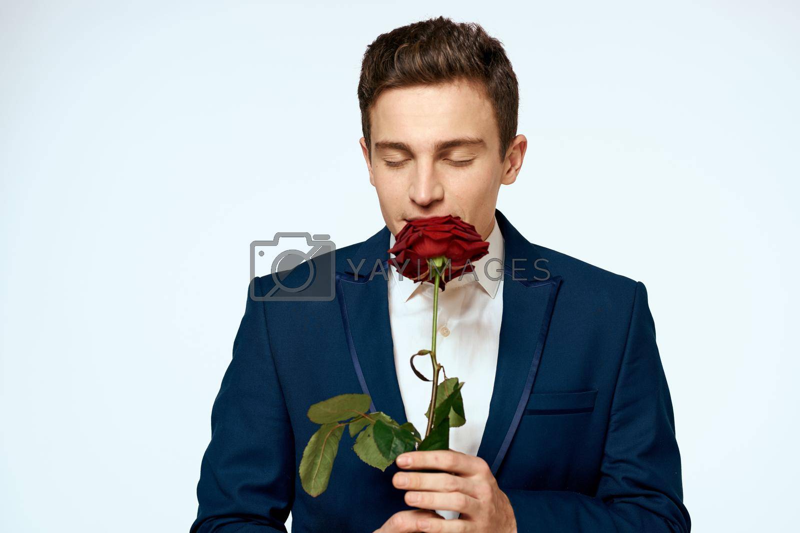 Business man in a flower suit romance date a gift. High quality photo