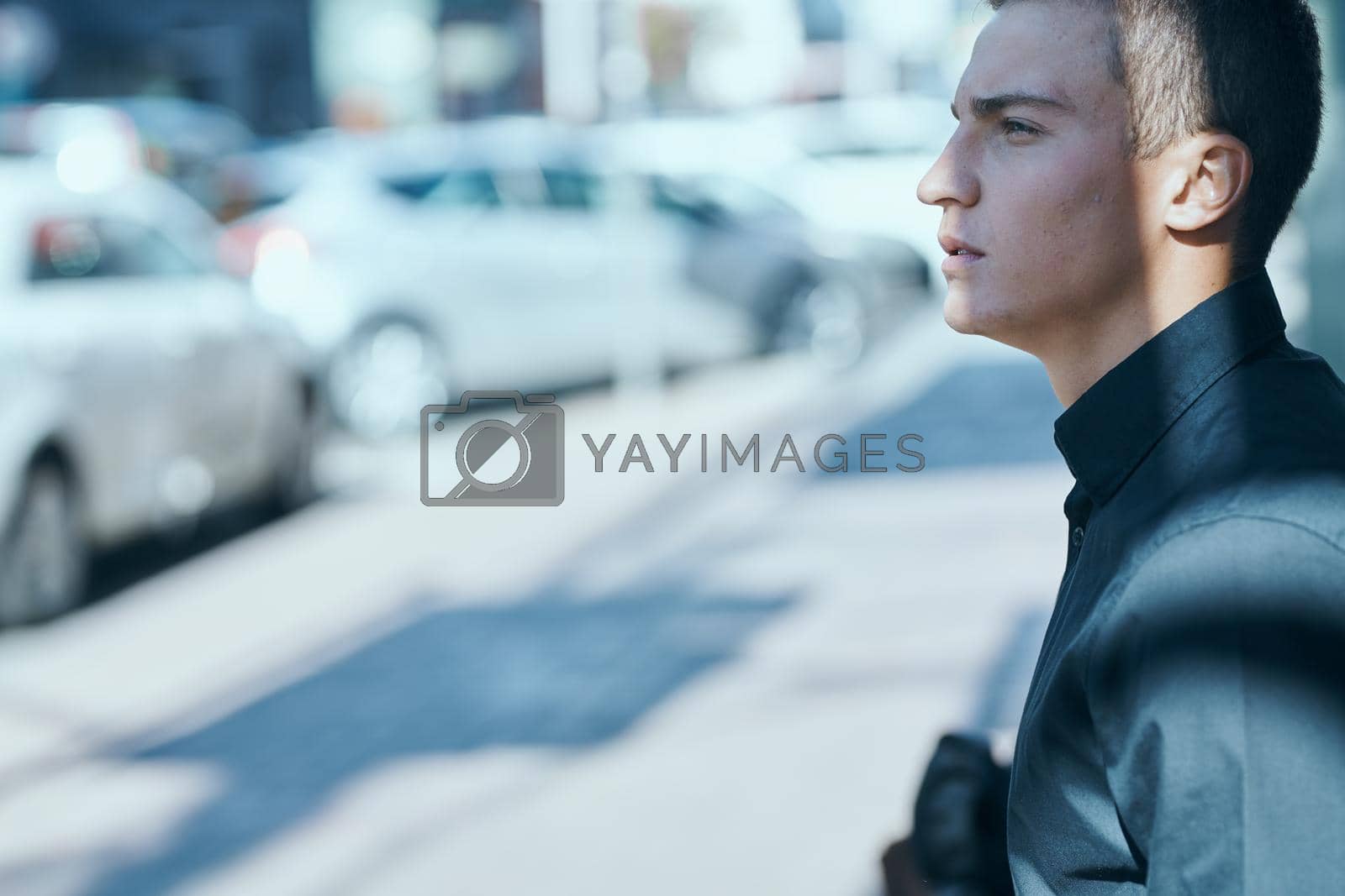 A man in a black shirt on the street an official communication professional. High quality photo