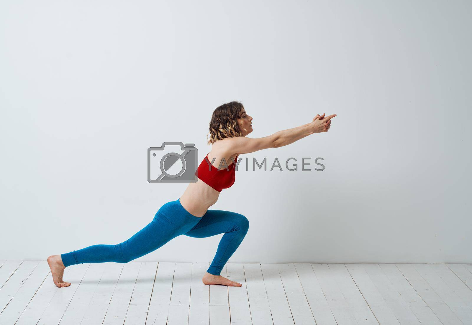 Royalty free image of Woman doing gymnastics exercises yoga asana sportswear by SHOTPRIME