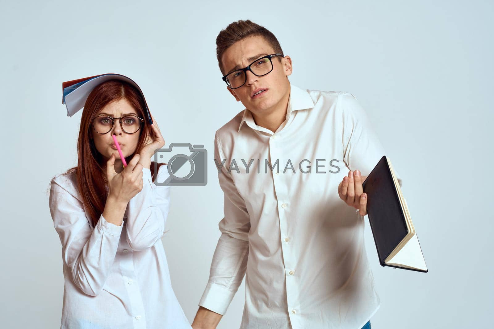 Young couple in white shirts are communication professional officials. High quality photo