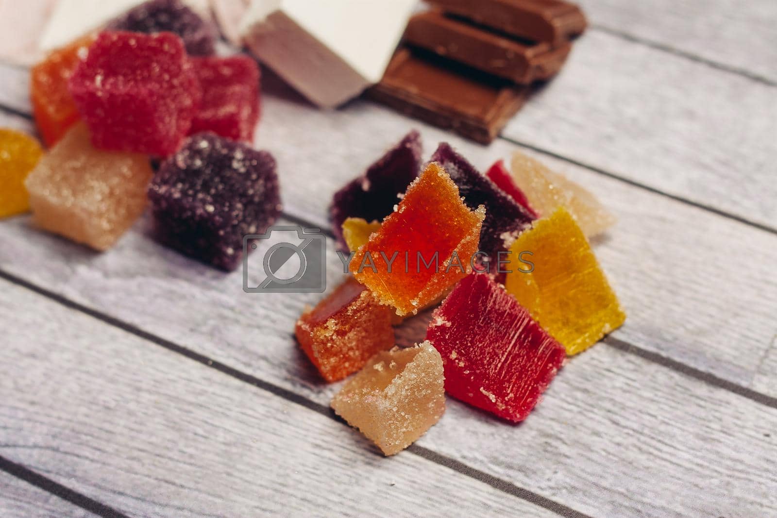 Royalty free image of multicolored marmalade candy sweets dessert wooden background by SHOTPRIME