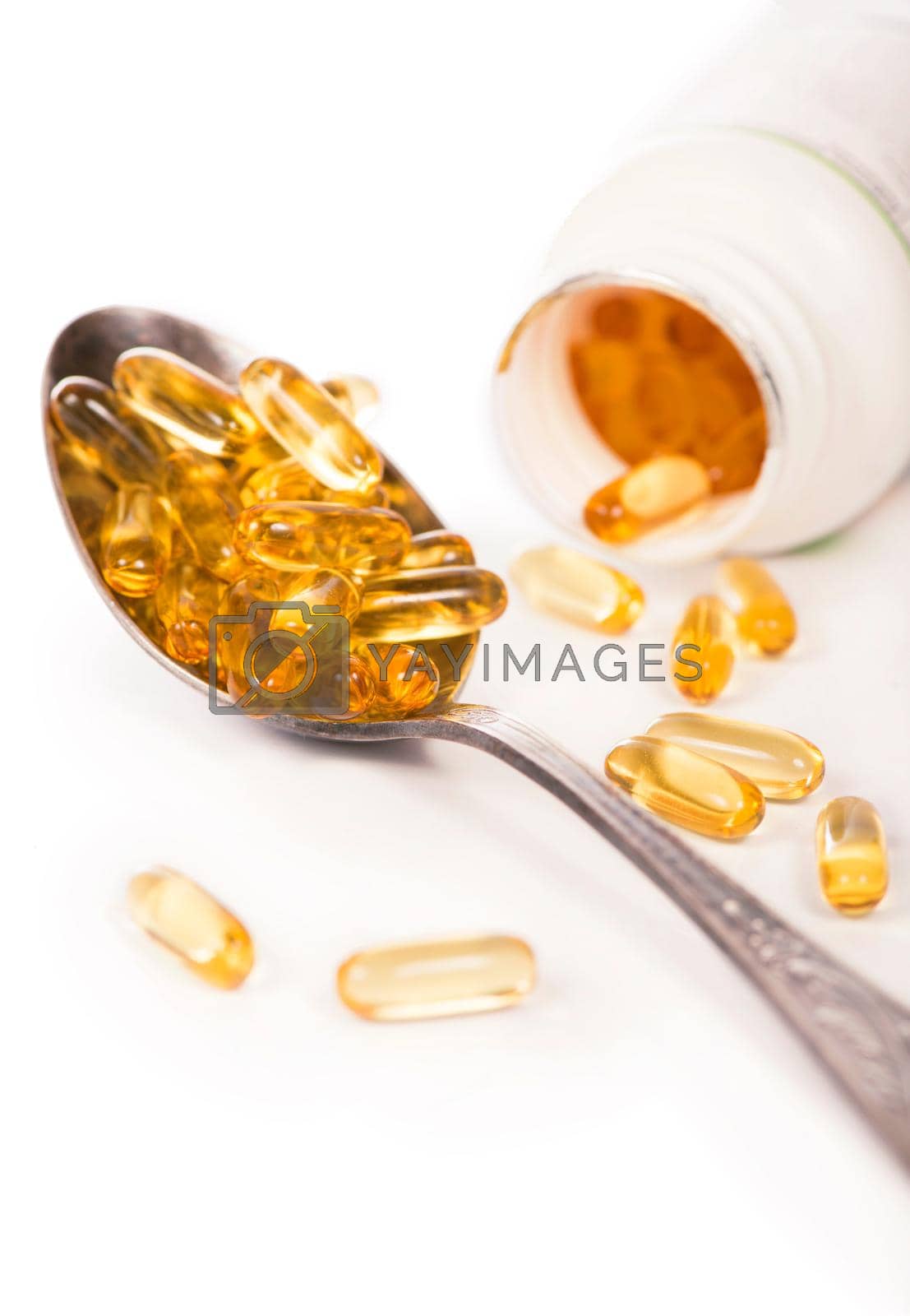 Royalty free image of Omega 3 pills ,Fish oil capsules with omega 3 and vitamin D on white background by aprilphoto