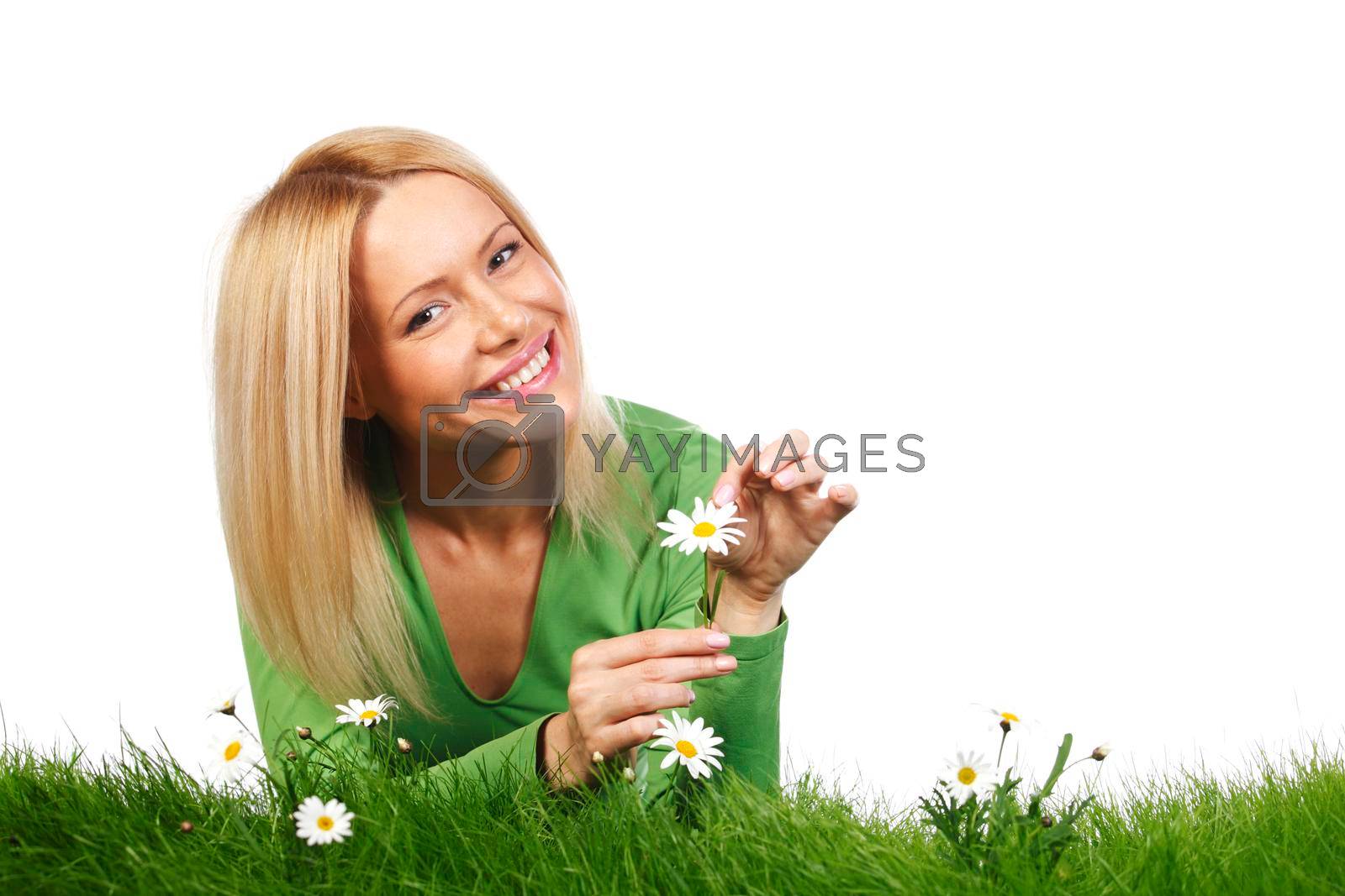 Royalty free image of Woman on grass with flowers by Yellowj