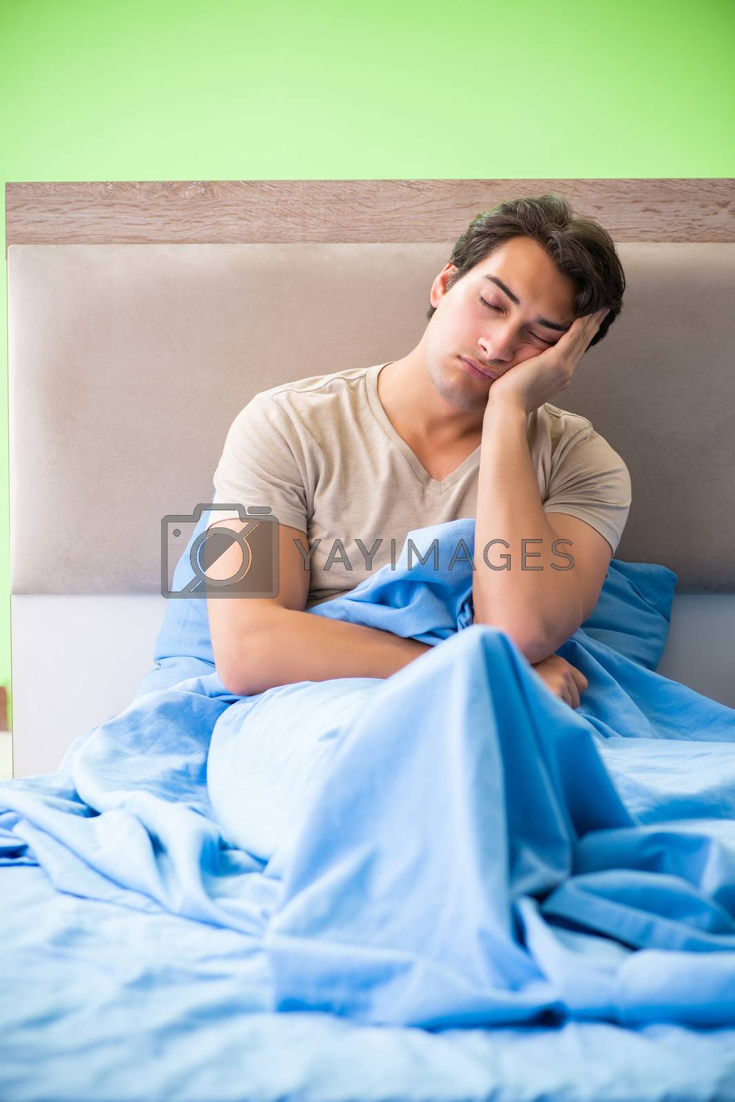 Royalty free image of Man having trouble with his sleep by Elnur