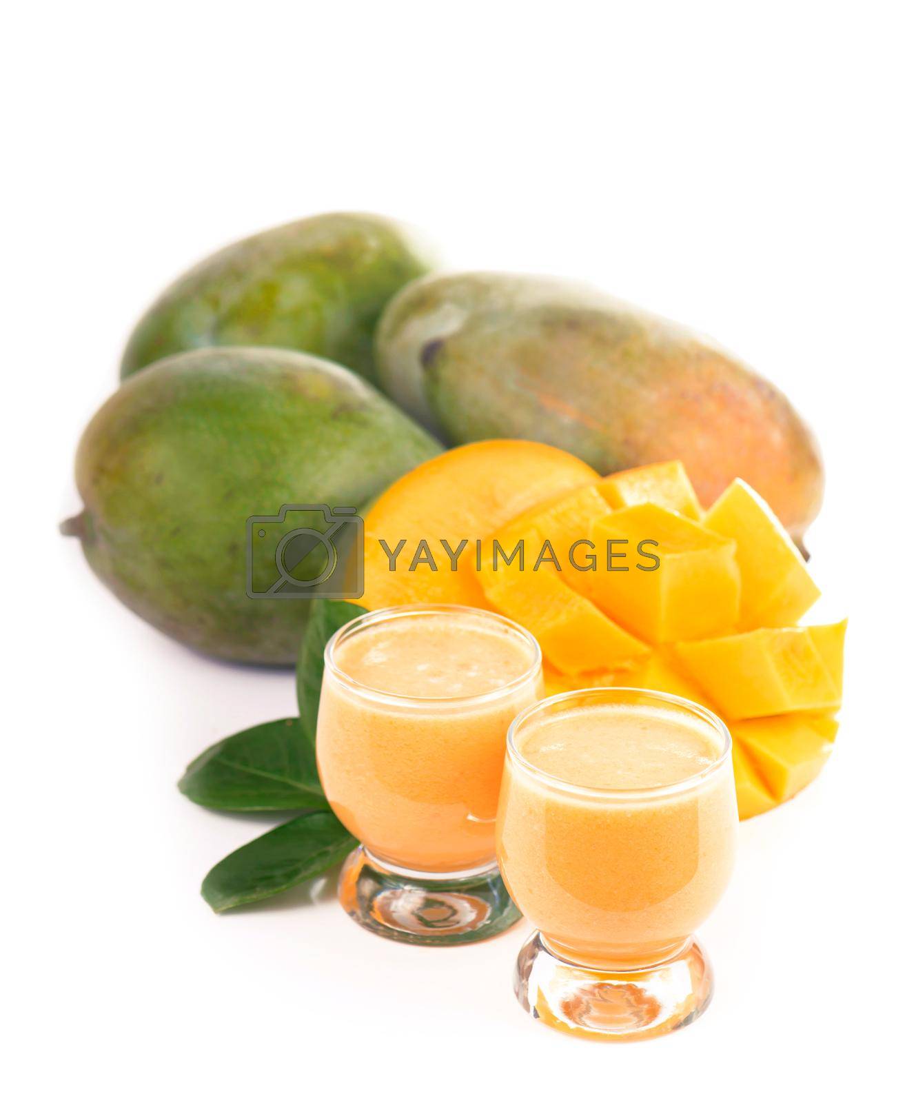 Royalty free image of exotic juicy mango fruits and two glasses of fresh natural mango juice isolated on white background by aprilphoto