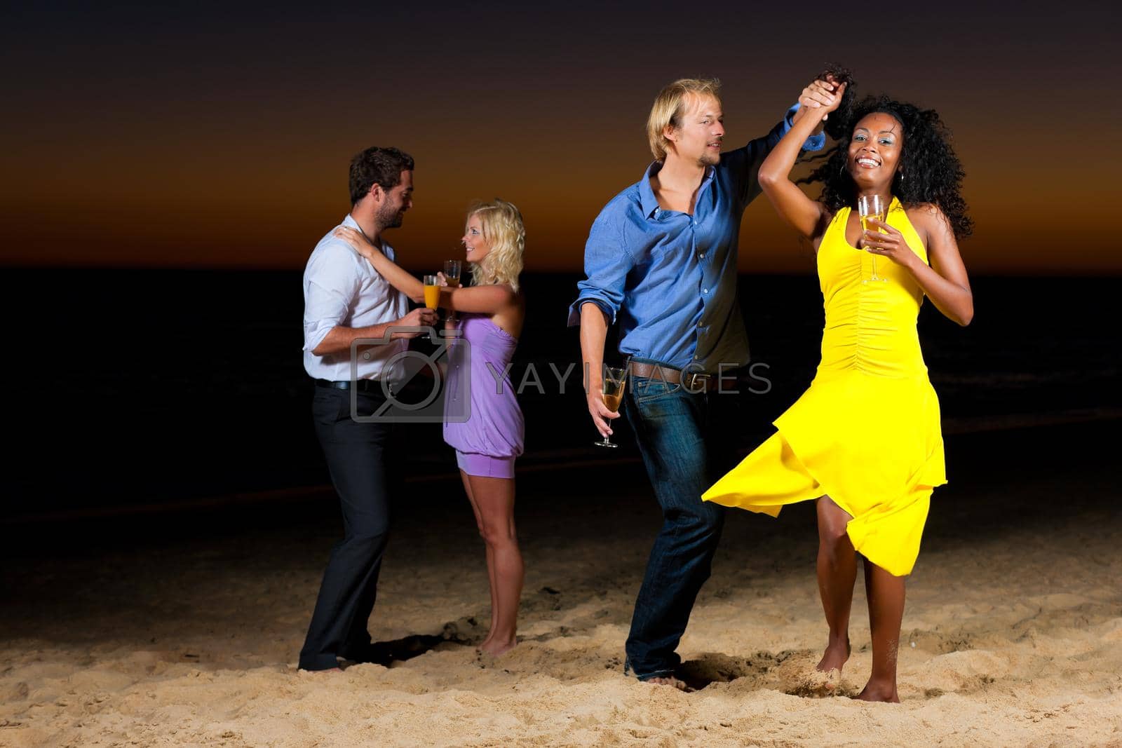 Royalty free image of Party and dancing at the beach by Kzenon