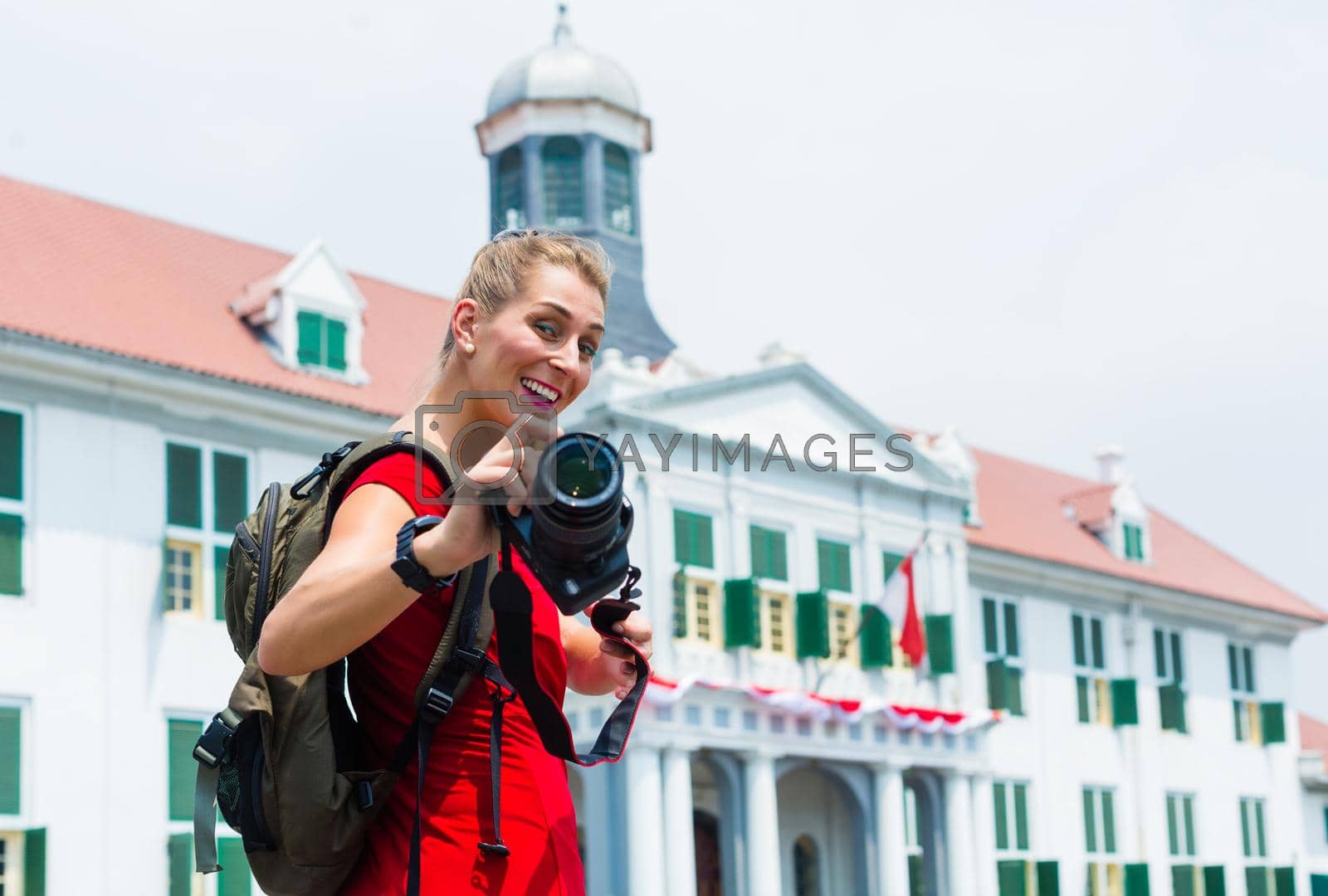 Royalty free image of Tourist taking pictures sightseeing in Jakarta, Indonesia by Kzenon