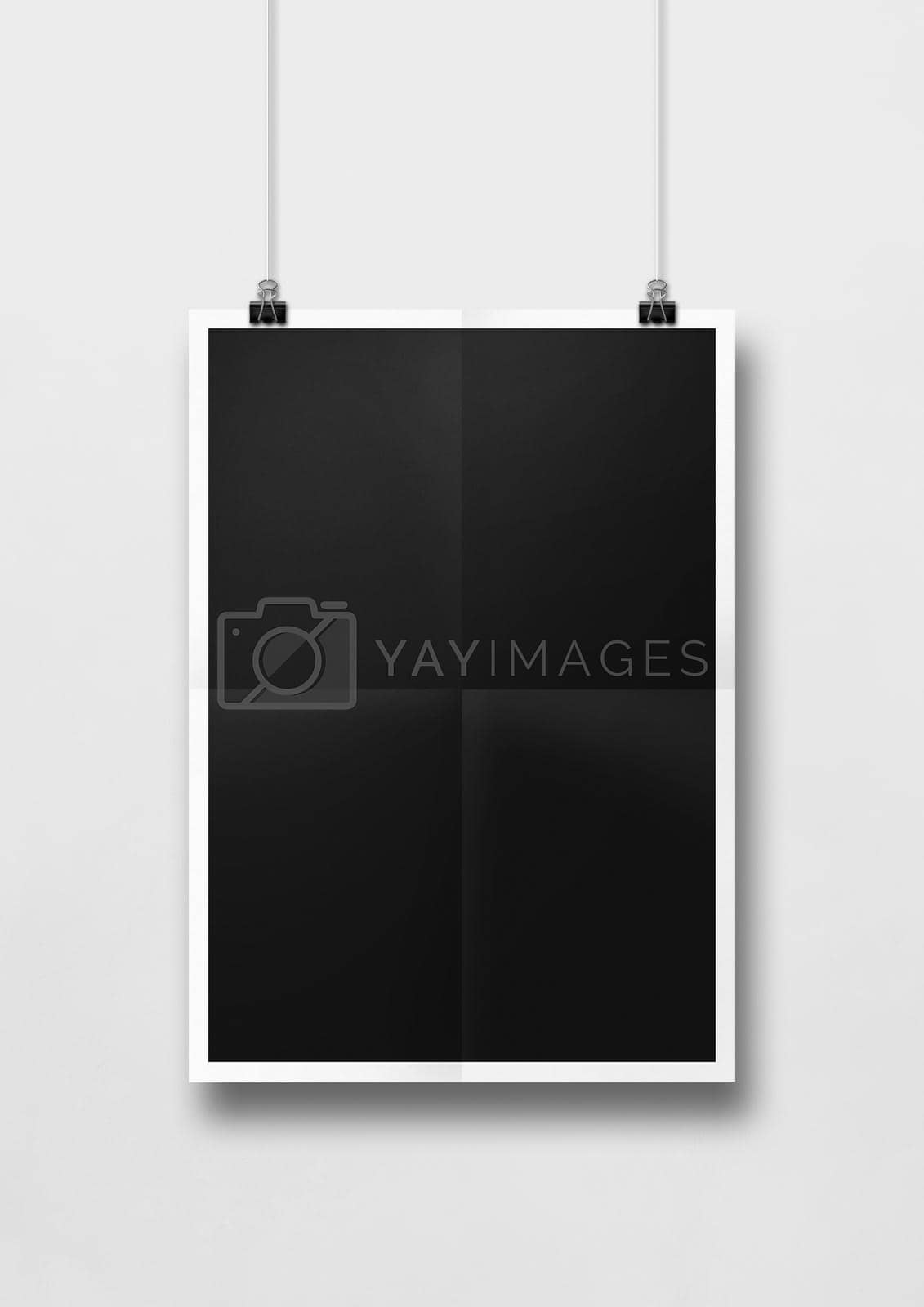 Royalty free image of Black folded poster hanging on a white wall with clips by daboost