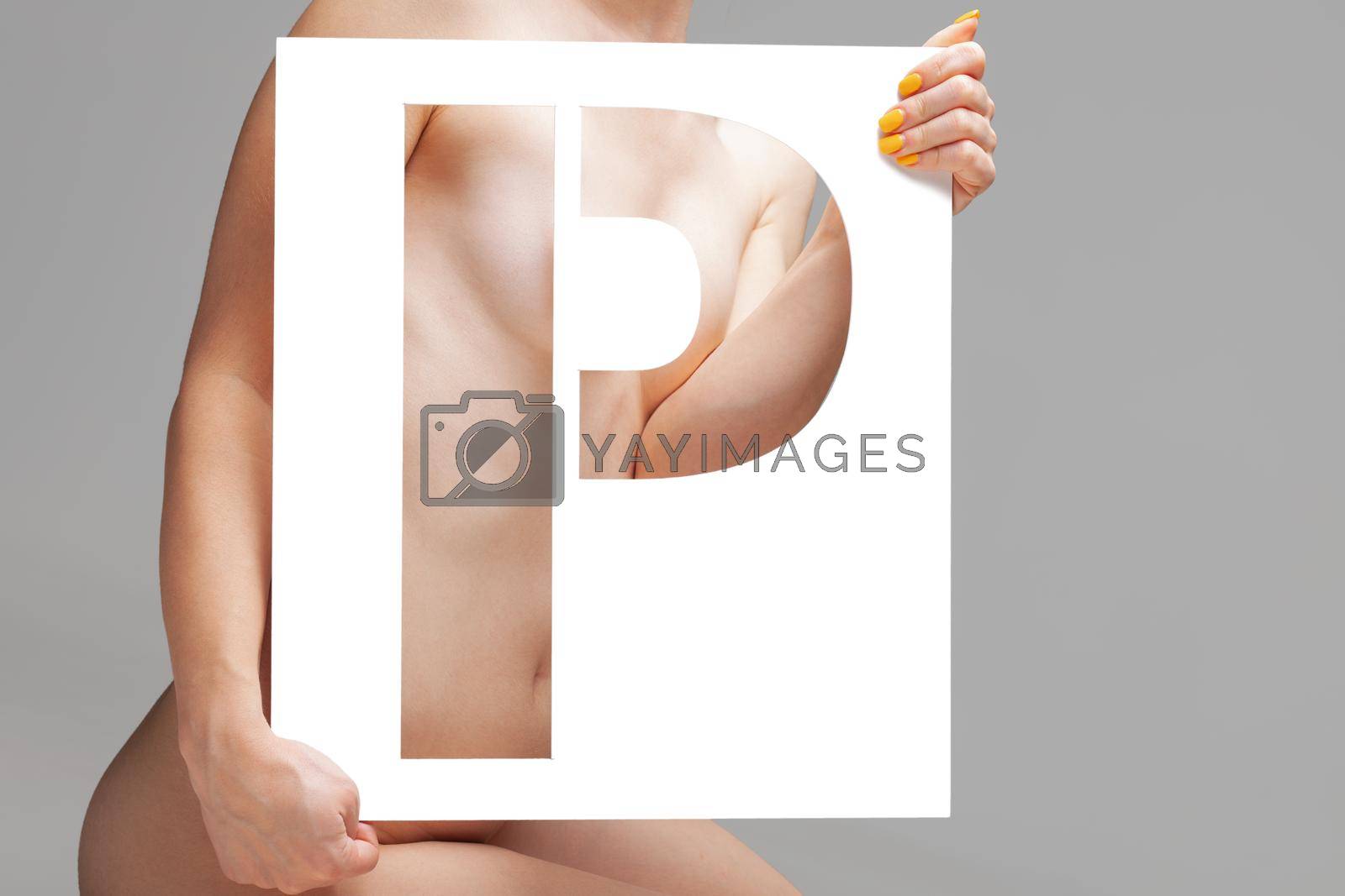 Royalty free image of nude girl holding stencil letter p by kokimk