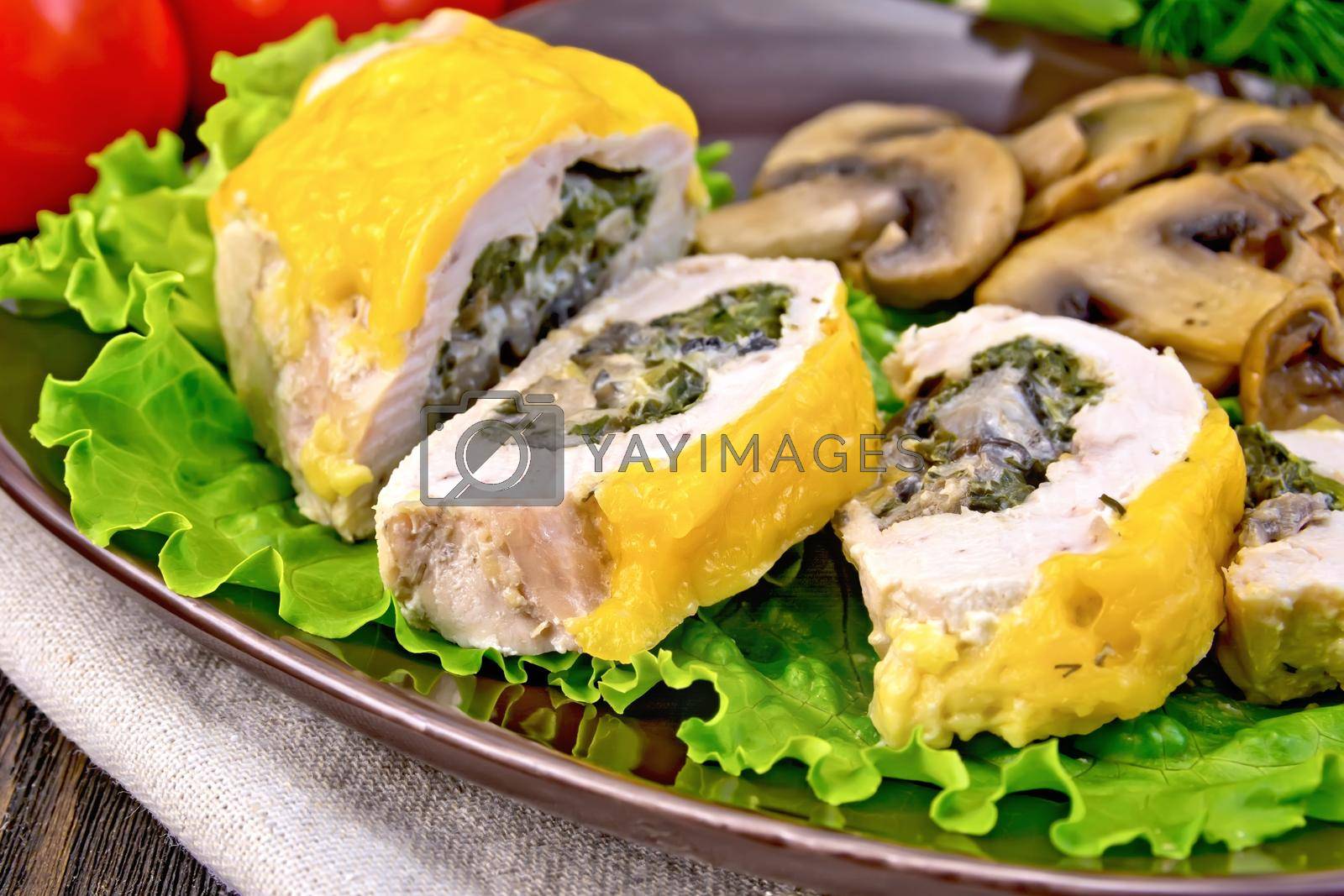 Royalty free image of Roll chicken with champignons on board by rezkrr