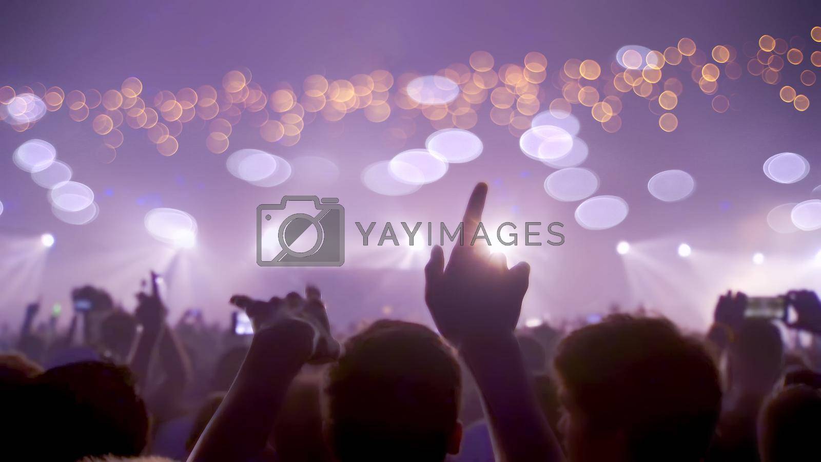 Royalty free image of Concert Music festival and Celebrate. Party People Rock Concert. Crowd Happy and Joyful and Applauding or Clapping. Celebration party festival happiness. Blurry night club. Concert Show with DJ Music festival EDM on Stage by chuanchai