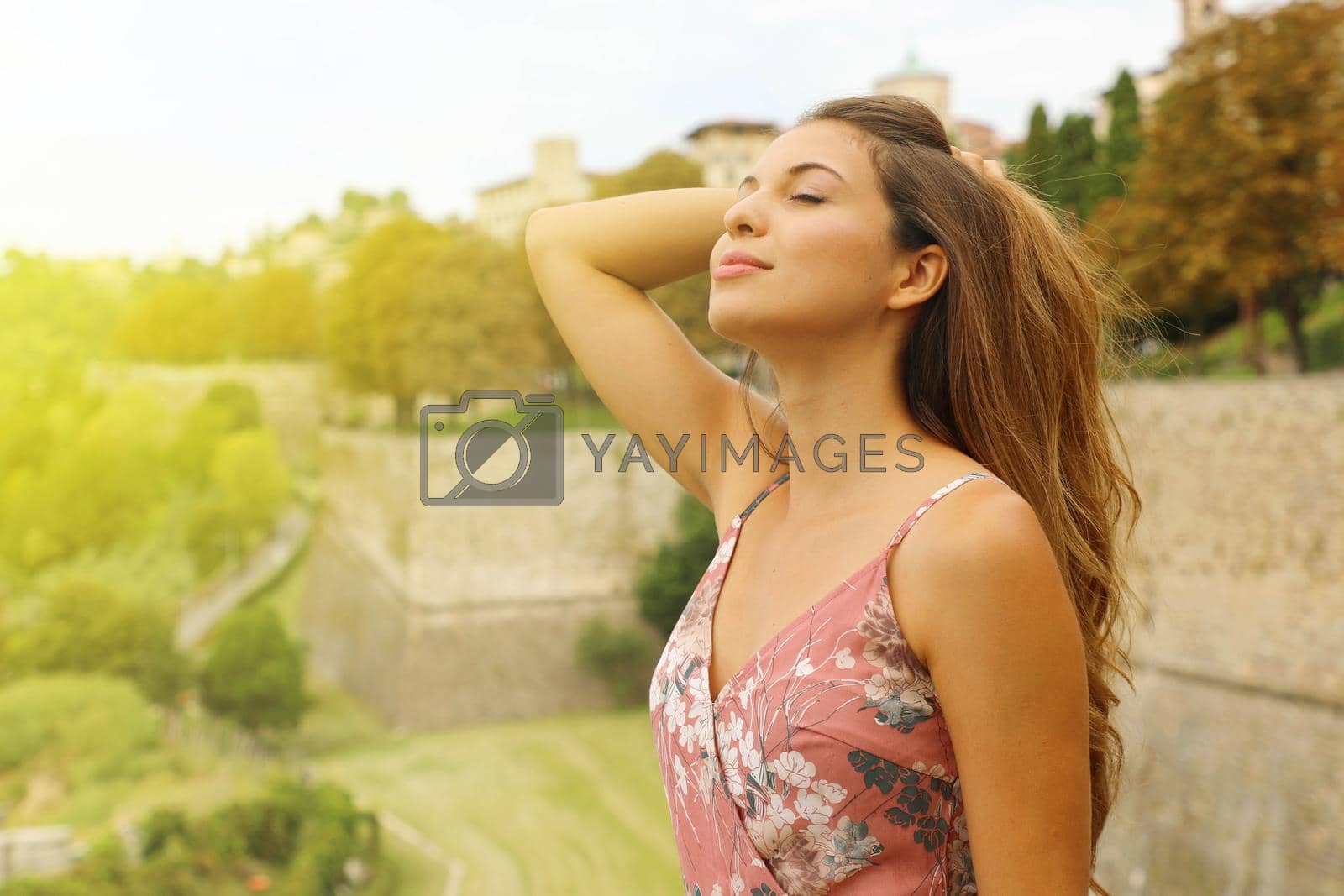 Elegant sensual fashion woman breathes outdoor.