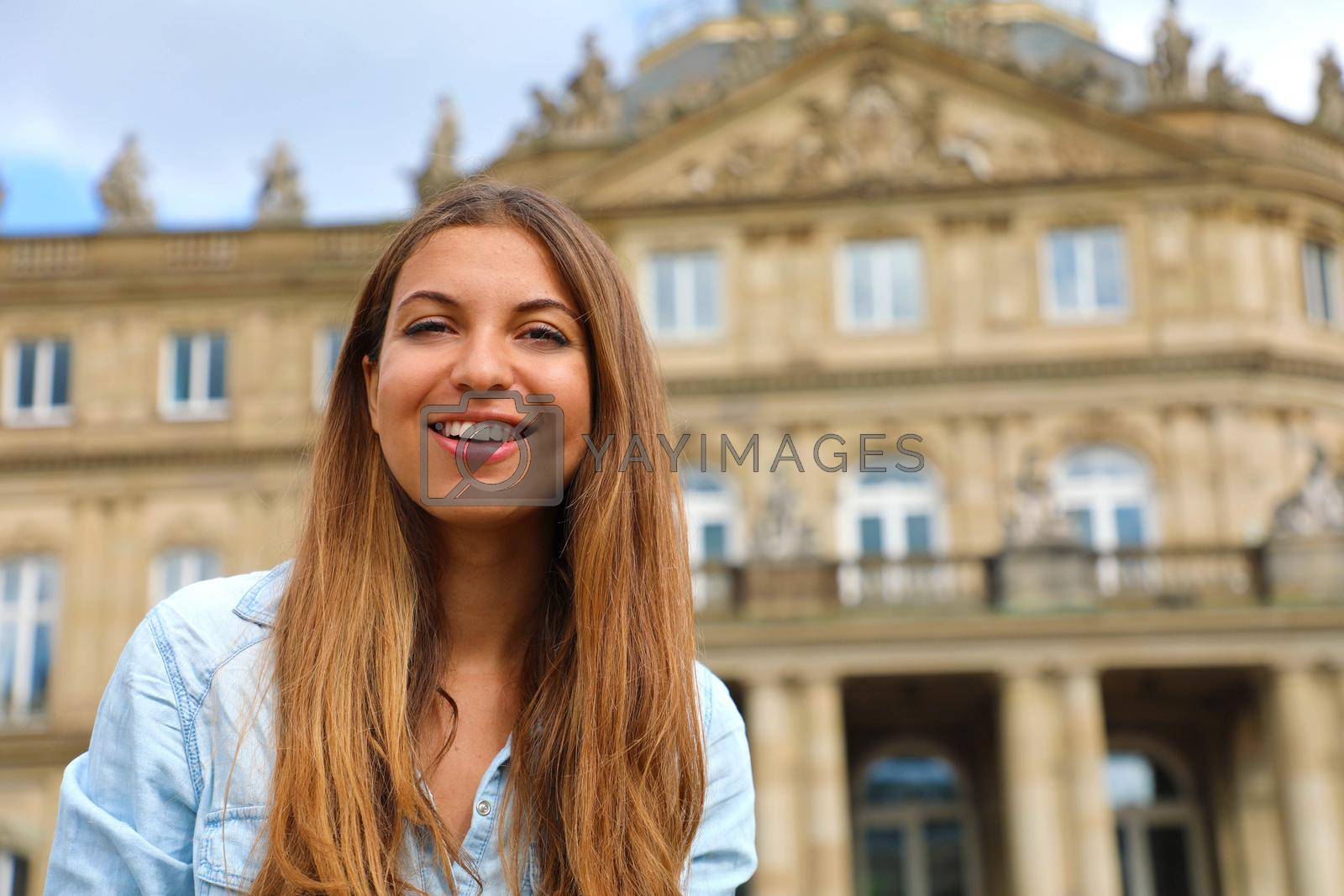 Royalty free image of Smiling young woman in front of Neues Schloss (New Palace) of Stuttgart, Germany by sergio_monti