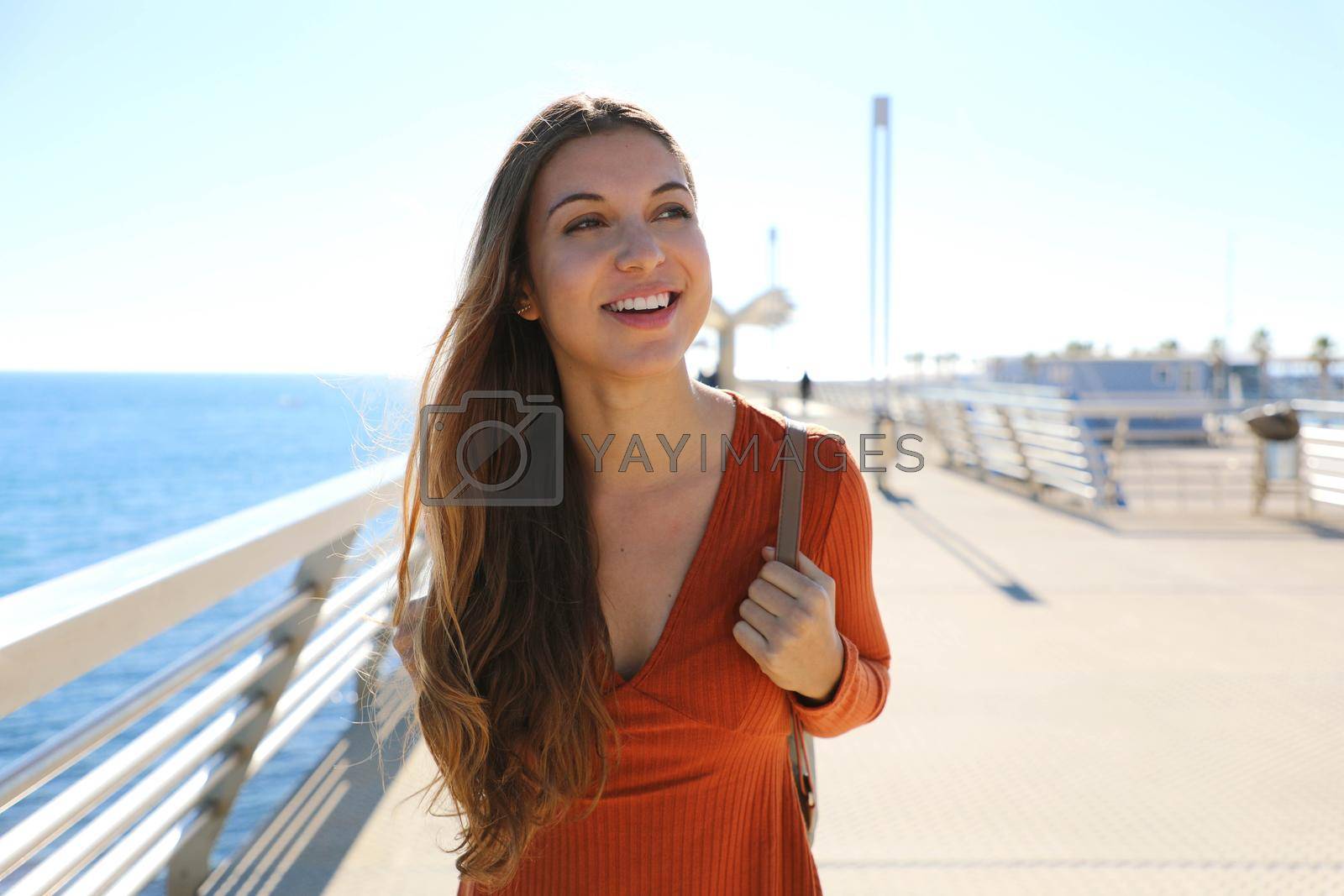 Pretty young tourist girl walking relaxing and enjoying travel in Europe.