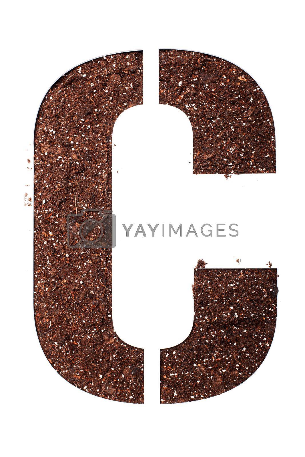 Royalty free image of stencil letter C made above dirt on white surface by kokimk