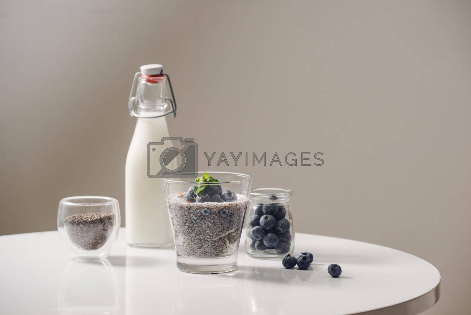 Royalty free image of Chia pudding with fresh berries and almond milk. Superfood concept. Vegan, vegetarian and healthy eating diet with organic products by makidotvn