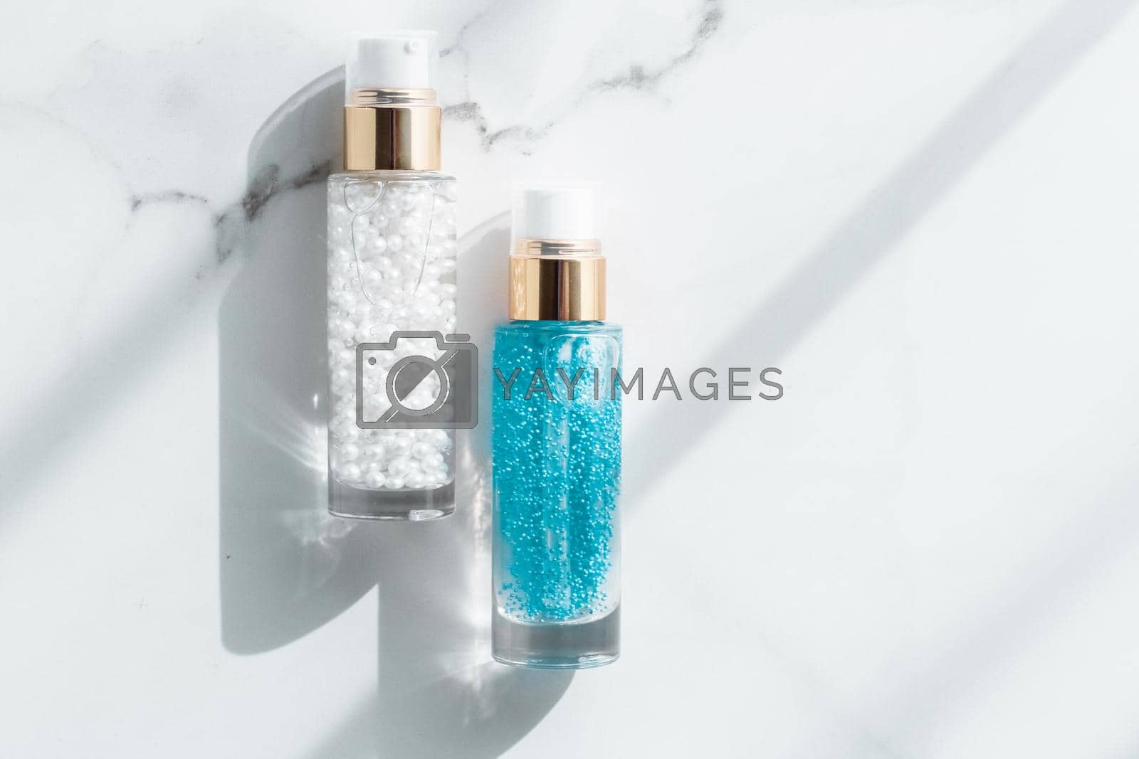 Royalty free image of Skin care serum and gel bottle, moisturizing lotion and lifting cream emulsion on marble, anti-age cosmetics for luxury beauty skincare brand design by Anneleven