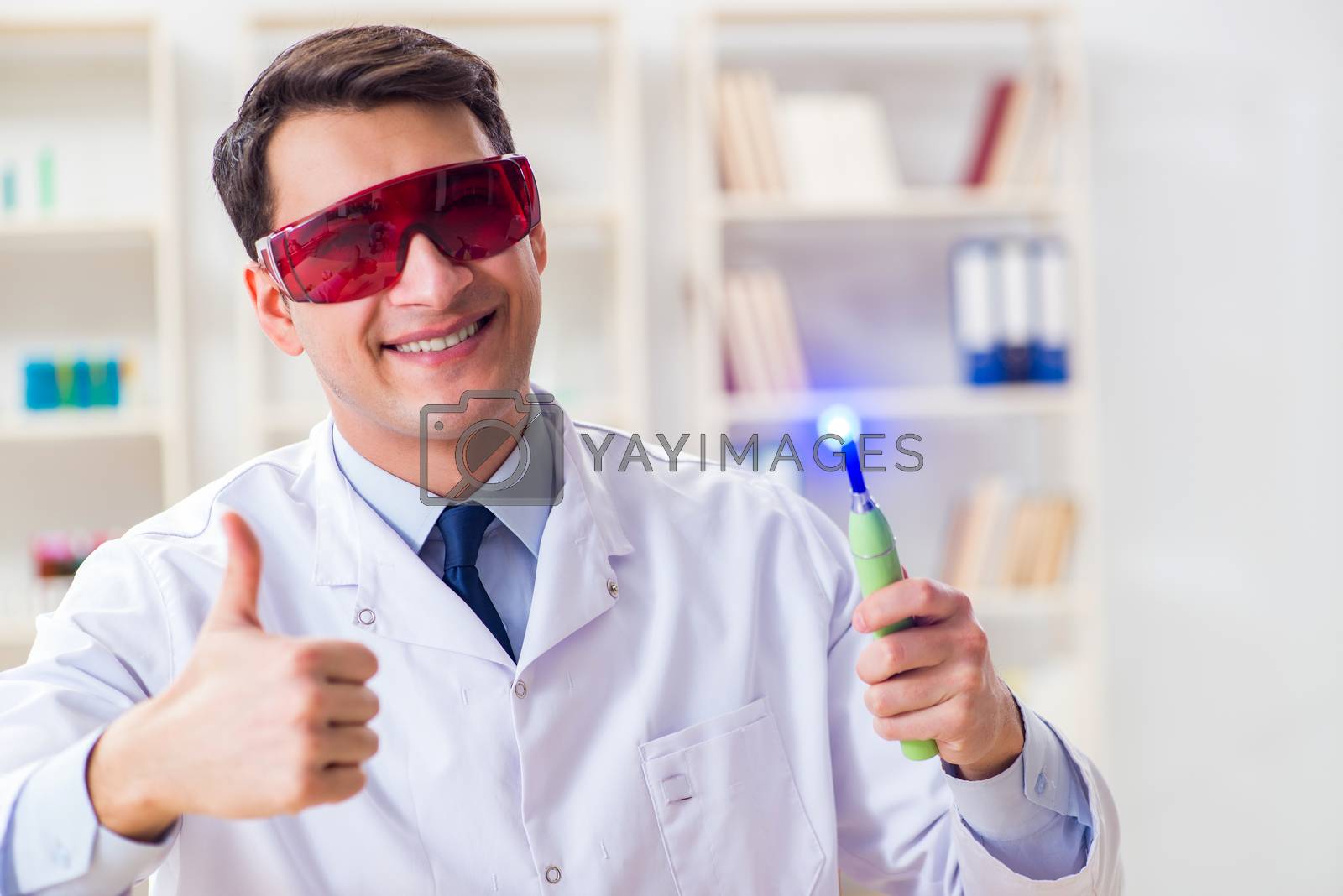Royalty free image of Young dentist working in the dentistry hospital by Elnur