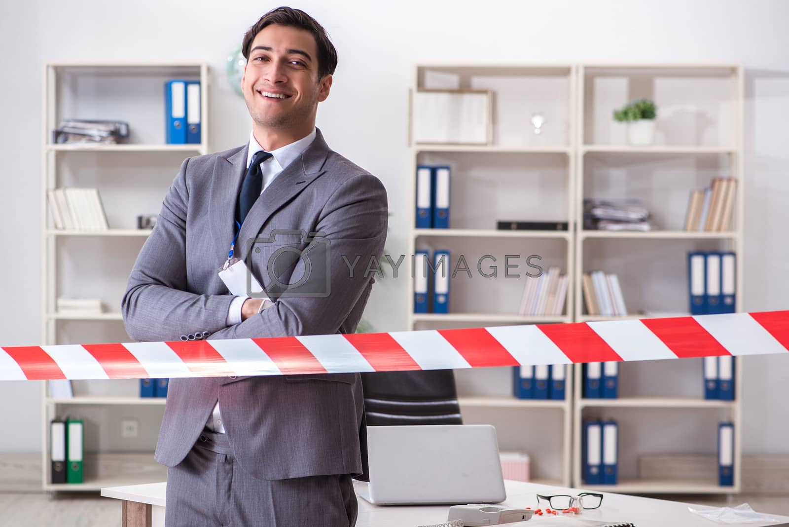 Royalty free image of Forensics investigator at the scene of office crime by Elnur