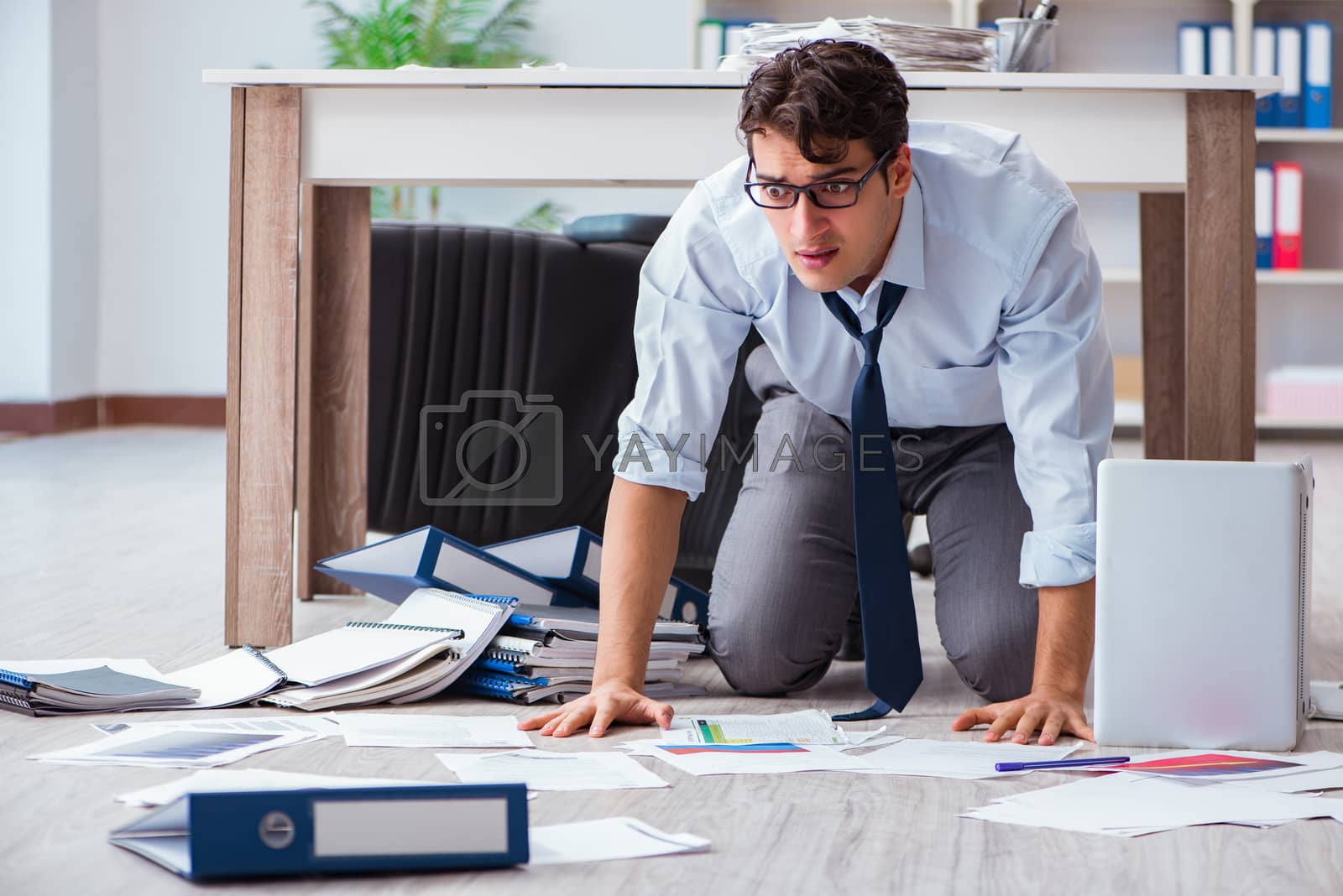 Royalty free image of Bankrupt businessman angry in the office floor by Elnur