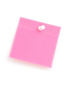 Close up of a pink adhesive note with pushpin