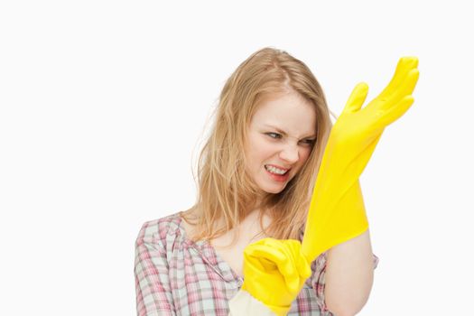 Angry woman wearing cleaning cloves
