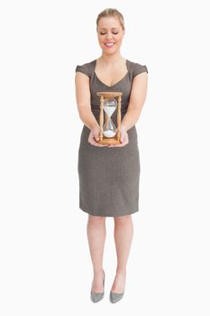 Woman holding a hourglass
