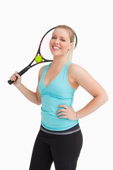Woman holding a racquet behind her head