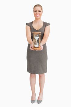 Woman holding a hourglass
