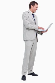 Side view of businessman working on his laptop