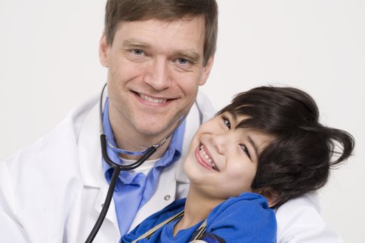 Male doctor holding disabled  toddler patient on lap