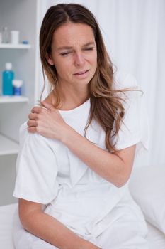 Woman covering painful spot