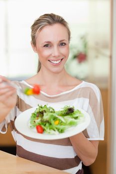 Woman offering salad