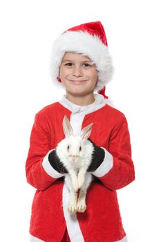 Boy holding a christmas rabbit isolated on white background