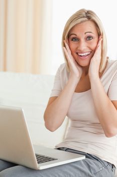 Delighted woman with a laptop