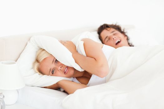Angry woman awaken by her husband's snoring