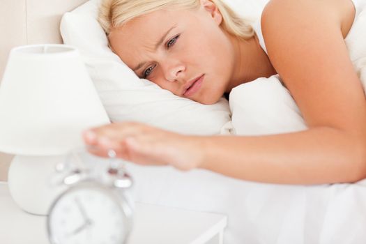 Woman awaken by an alarmclock