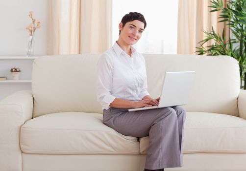 Beautiful short-haired woman with a laptop