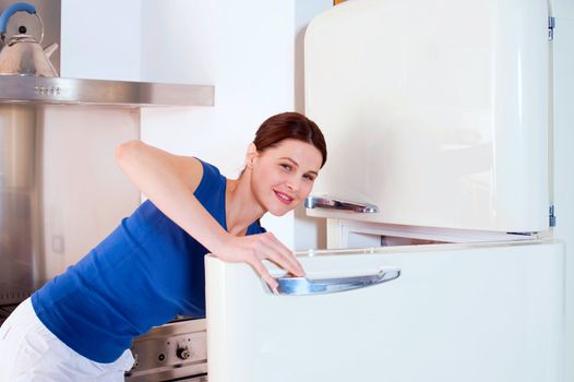 woman opening the refrigerator