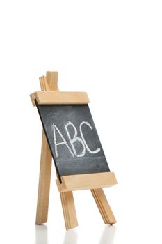 Angled chalkboard with the letters abc written on it