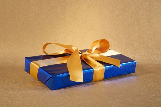 brilliant blue gift box with golden bow