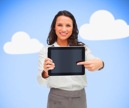 Businesswoman pointing to her digital tablet