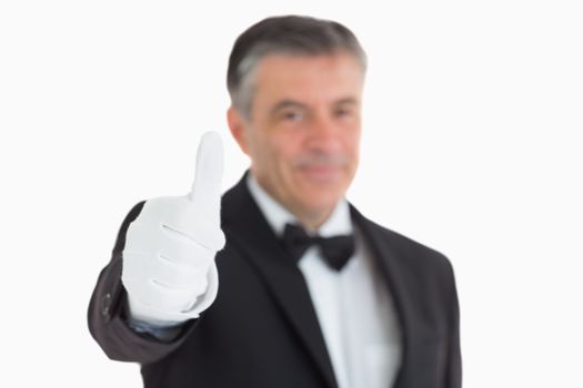 Glad waiter having thumbs up