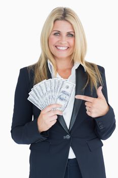 Happy Well-dressed woman holding dollars