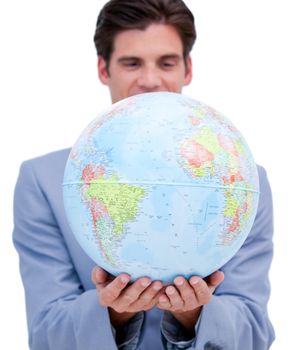 Portrait of an ambitious man holding a terrestrial globe